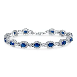 Bridal Tennis Bracelet with Oval CZ Simulated Blue Sapphire Sterling Silver 7.5 Inch